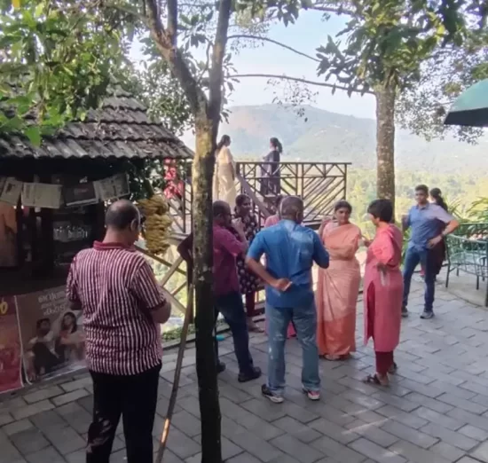 Guest enjoying traditional tea at forest canopy resort in kerala